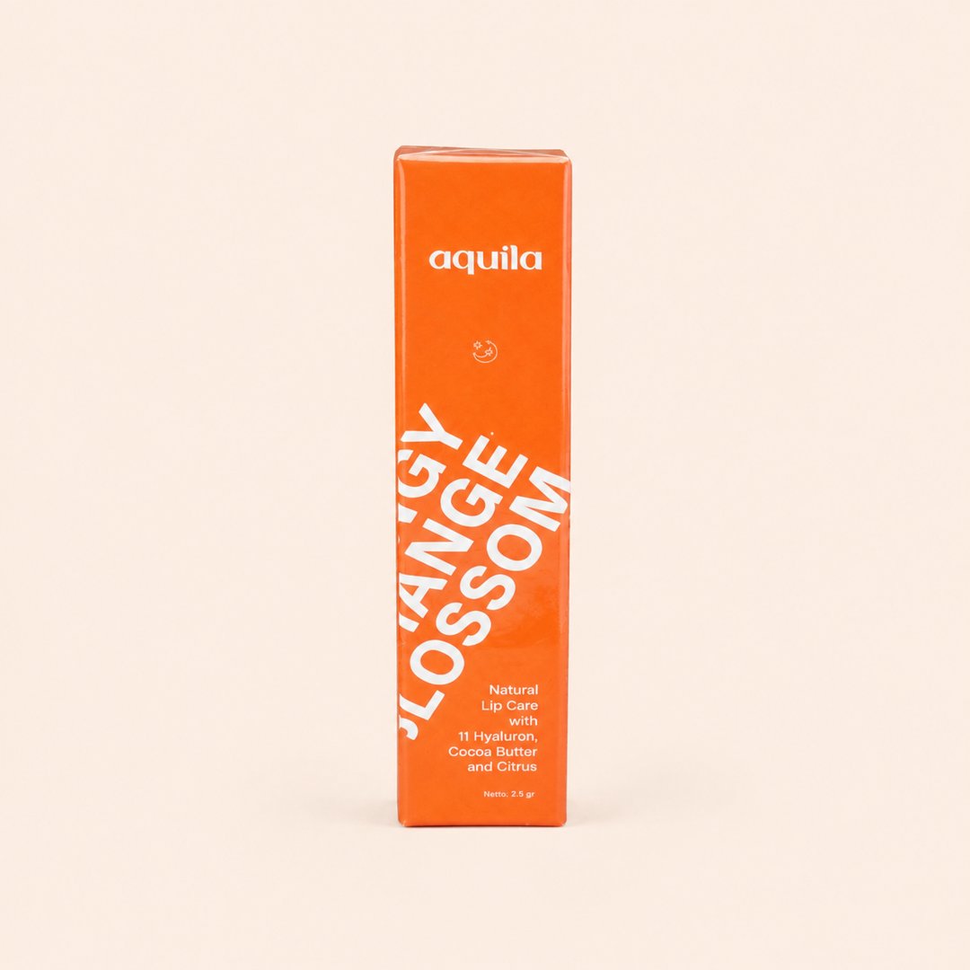 Cover produk Aquila Tangy Orange Blossom Natural Lip Care 2.5gr dengan latar krem