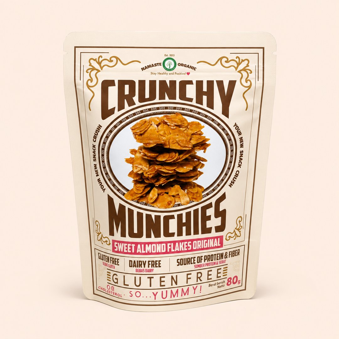 Cover produk Crunchy Munchies Sweet Almond Flakes Original 80g - Namaste Organic dengan latar krem