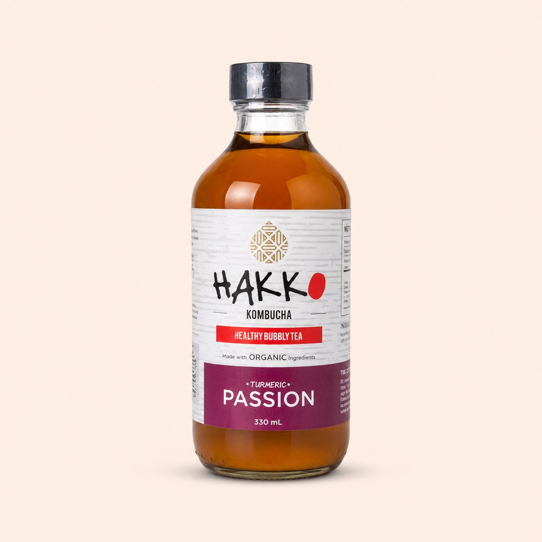Cover produk Hakko Kombucha Turmeric Passion 330ml dengan latar krem