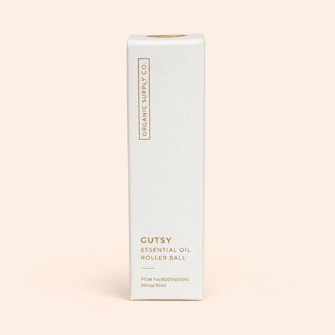Cover produk Gutsy Essential Oil Roller Ball 10ml - Organic Supply Co dengan latar krem