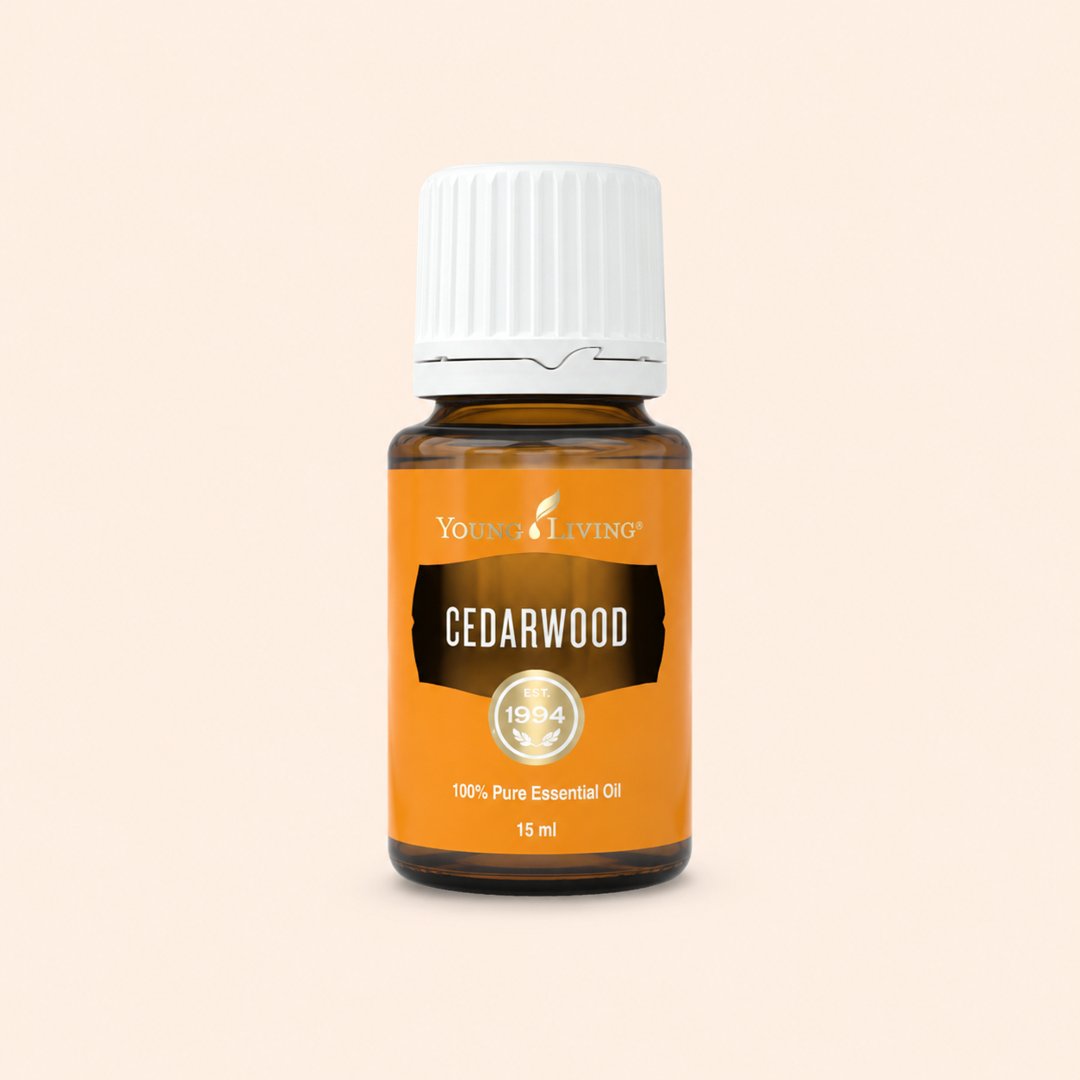 Cover produk Young Living Cedarwood Essential Oil 15ml dengan latar krem