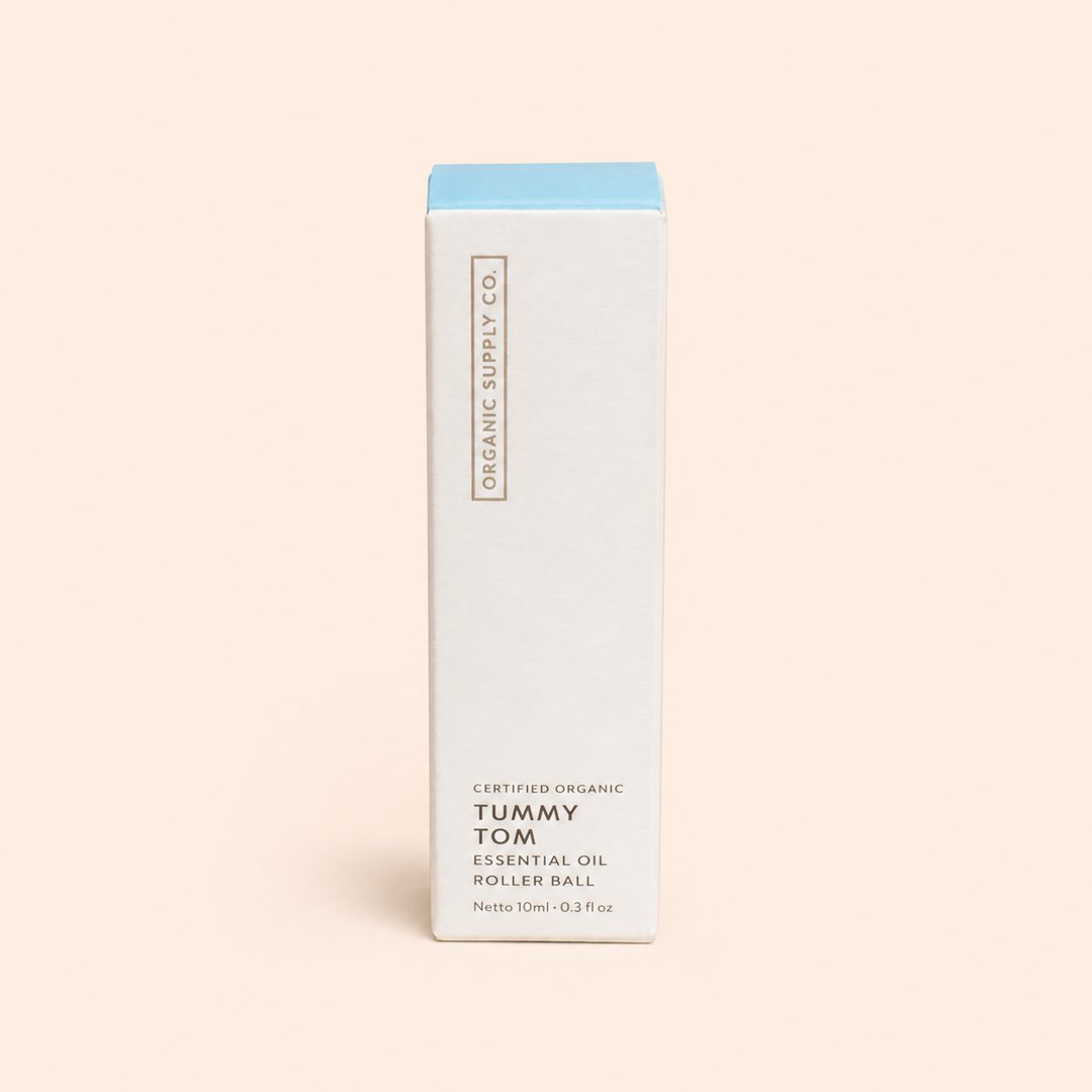Cover produk Organic Supply Co Tummy Tom Essential Oil Roller Ball 10ml dengan latar krem